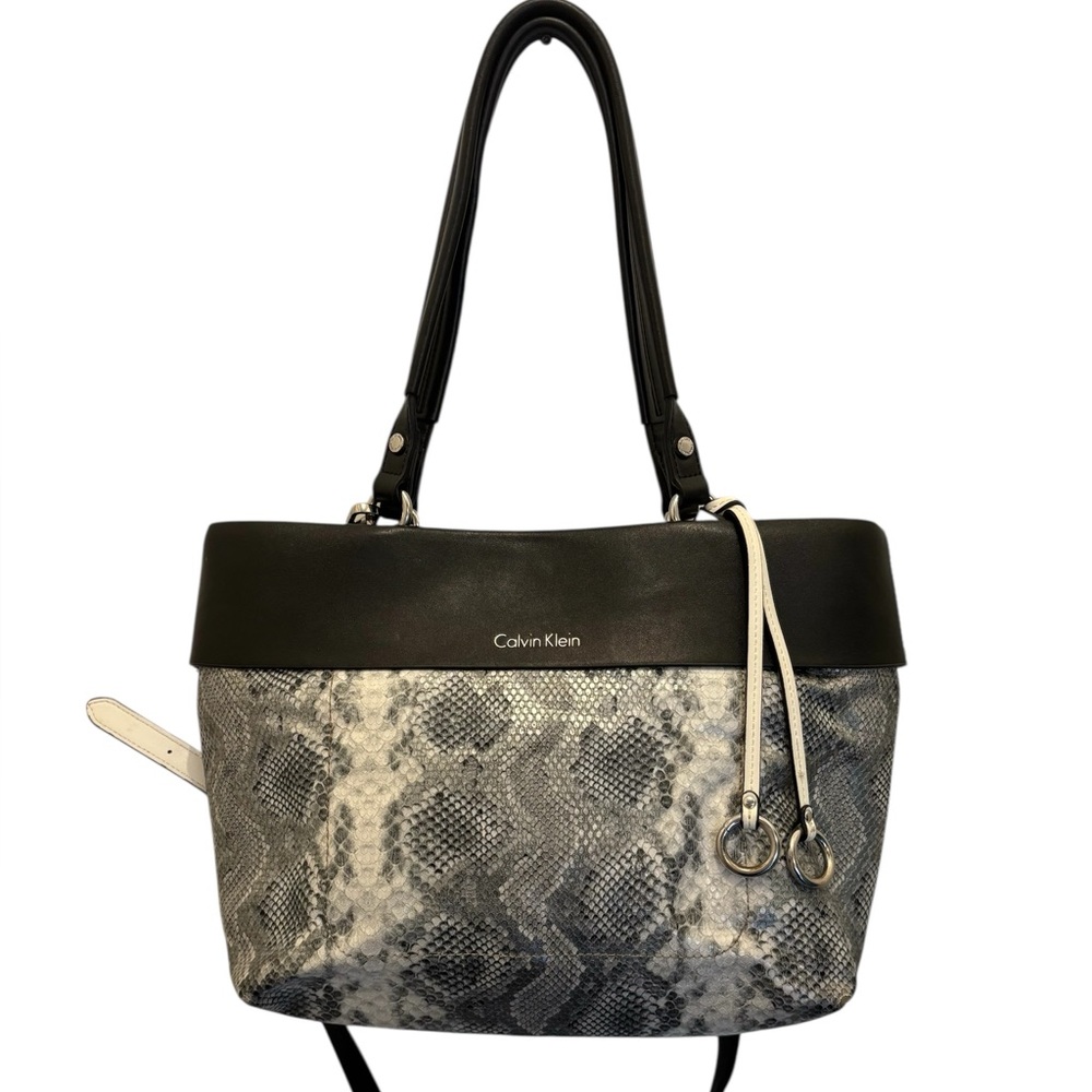 Calvin Klein Black Began Leather Handbag With Leather Double Straps.